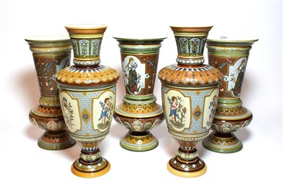 Lot 294 - Mettlach vases comprising, a pair decorated with stylized flowers and painted cartouche of cherubs