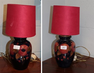 Lot 297 - Pair of William Moorcroft pomegranate vases (converted to lamps) (2)