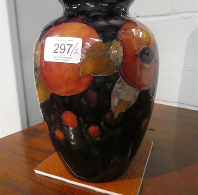 Lot 297 - Pair of William Moorcroft pomegranate vases (converted to lamps) (2)