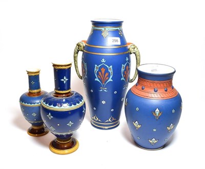 Lot 298 - Mettlach vases with deep blue ground, including an example decorated with stylized flowers and twin