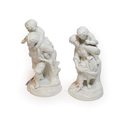 Lot 306 - A pair of continental white glazed figure groups
