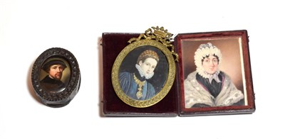 Lot 321 - An enamelled portrait miniature of a gentleman in carved wood frame, together with a further...
