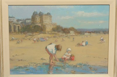 Lot 1007 - Richard Marshall (1944-2006)  Children making sandcastles on the beach at Scarborough Signed,...