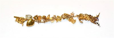 Lot 363 - A charm bracelet, stamped '9CT', hung with various charms including a chick, a bell, a fox, a fried
