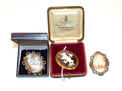 Lot 366 - A cameo brooch, frame stamped '9CT' a cameo brooch depicting a lady reading and a cameo brooch...