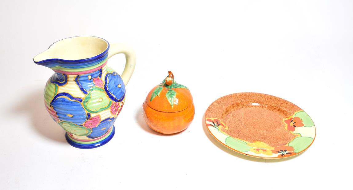 Lot 376 - A Clarice Cliff Bizarre ribbed jug, in the Chintz pattern, 17cm height, together with a side...