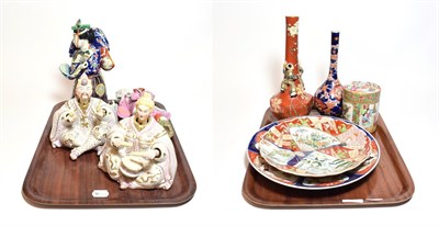 Lot 387 - A selection of oriental ceramics including Japanese Imari plates, two vases, bisque Japanese...