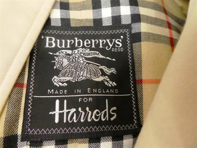 Lot 416 - A Burberry raincoat, a Burberry wool flat cap, a Louis Feraud red monogrammed shopping bag, a...