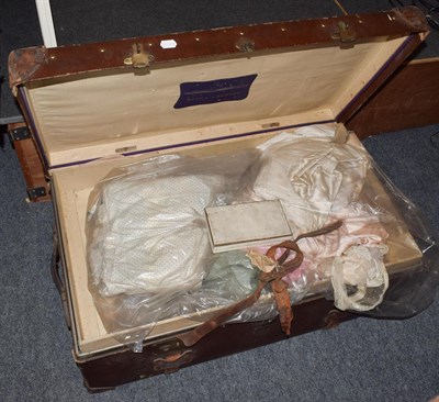 Lot 439 - * A large travelling case containing an assortment of 19th/20th century textiles, costume, lace etc