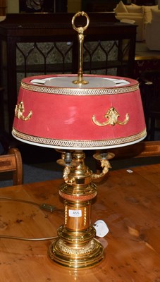 Lot 455 - An Empire style gilt metal three branch table lamp
