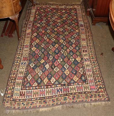 Lot 1000 - Kordi Kuchan rug, the polychrome diamond lattice field enclosed by ivory borders, 220cm by 110cm