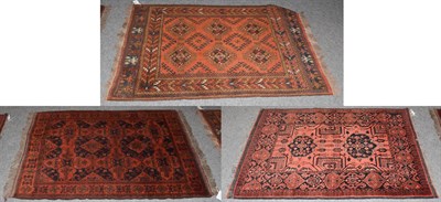 Lot 1007 - Afghan Turkman rug, the teracotta field of hooked guls, 143cm by 98cm together with two other...