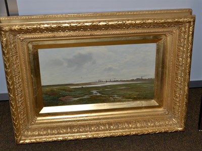 Lot 1119 - French School (19th century), Expansive landscape with distant shipyard, indistinctly signed...