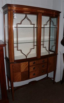 Lot 1145 - An Edwardian inlaid walnut display cabinet