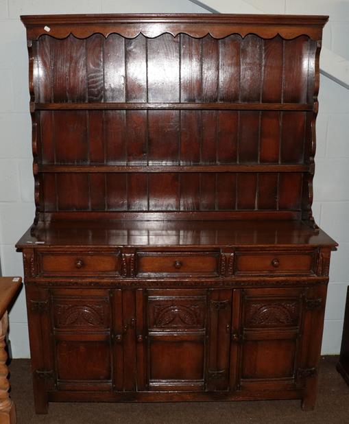 Lot 1156 - A Titchmarsh & Goodwin style oak dresser and rack