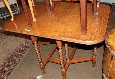 Lot 1162 - A nest of three tables, two piano stools, three foot stools and an oak gate-leg table (6)