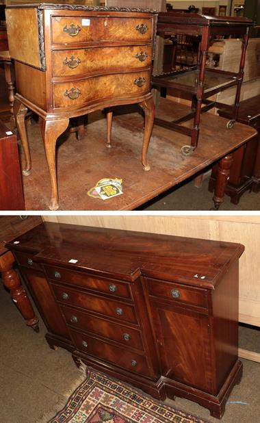 Lot 1166 - A reproduction mahogany break-front sideboard in a 20th century walnut veneered three-drawer...