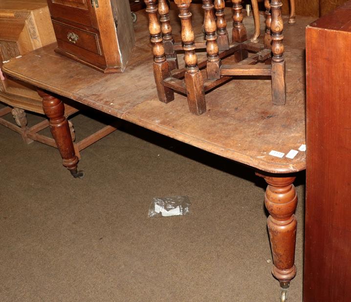 Lot 1173 - * A Victorian mahogany extending dining table with single leaf, raised on turned legs to castors