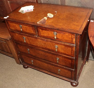 Lot 1177 - A reproduction walnut four-height chest of drawers