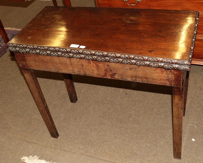 Lot 1189 - An early 19th century mahogany fold over card table