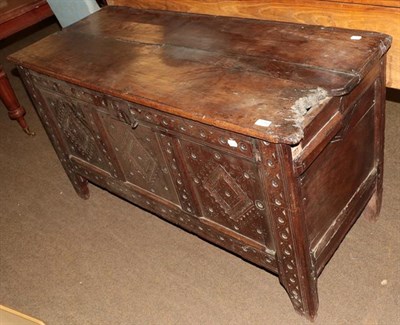 Lot 1200 - An early 18th century oak coffer, together with a rug (2)