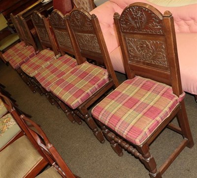 Lot 1207 - A set of six carved oak chairs