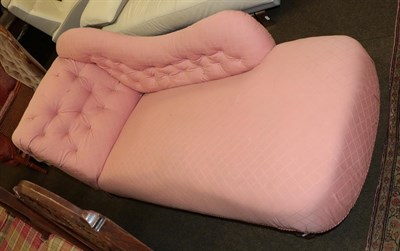 Lot 1208 - A late Victorian chaise lounge upholstered in pink fabric, raised on turned legs