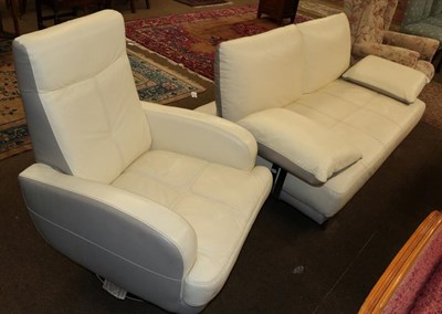 Lot 1211 - A modern leatherette two-seater sofa together with a matching swivel armchair