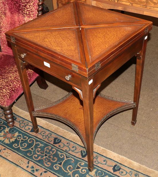 Lot 1214 - A 20th century leather inserted envelope top games table