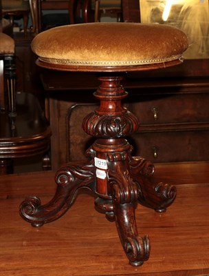 Lot 1219 - A Victorian rosewood revolving piano stool on cabriole tripod support