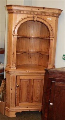 Lot 1238 - A George III style pine floor standing corner cupboard