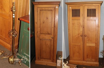 Lot 1239 - An oak cupboard with grill doors 103cm by 51cm by 211cm together with a single pine wardrobe...
