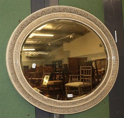 Lot 1244 - An early 20th century oval floral decorated wall mirror