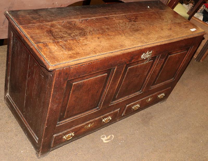 Lot 1248 - A George III oak three-panel mule chest