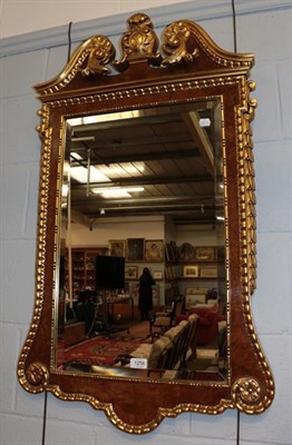 Lot 1256 - An Empire style gilt decorated wall mirror with acanthus leaf borders