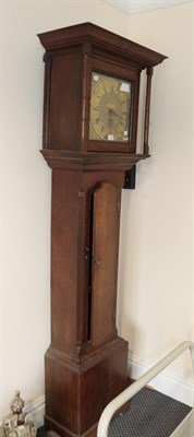 Lot 1258 - An oak thirty hour long case clock, the square brass dial with applied plaque inscribed Thomas...