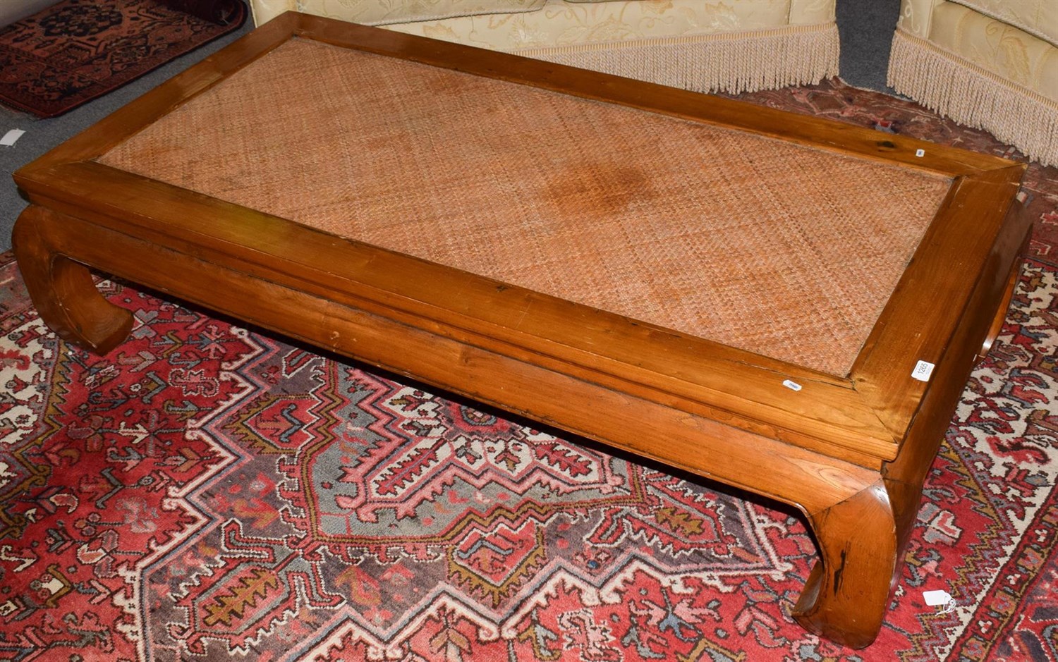 Lot 1265 - A 20th century Chinese hardwood coffee table with a rattan top, 166cm wide by 86cm deep by 42cm...