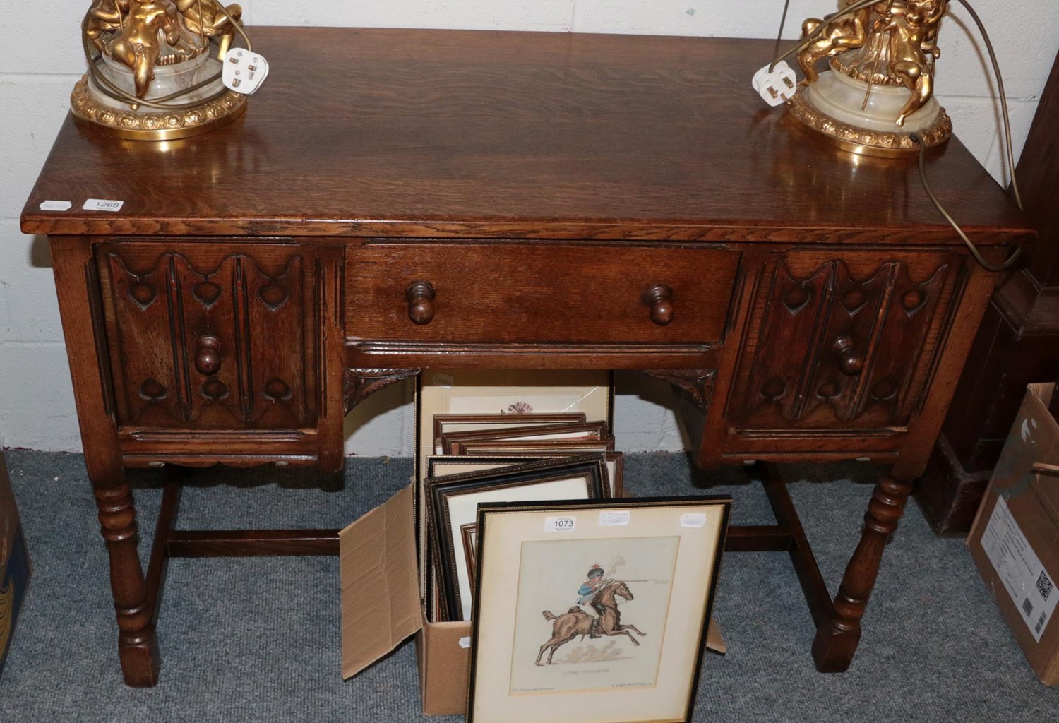 Lot 1268 - A 20th century oak desk