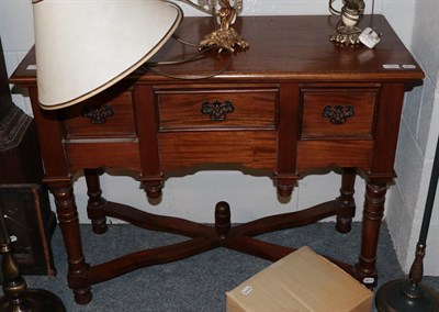 Lot 1274 - A reproduction three-drawer side table