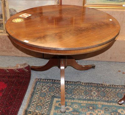 Lot 1293 - A regency style brass inlaid mahogany tilt-top circular breakfast table, 106cm diameter by 73cm...