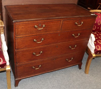 Lot 1294 - An early 19th century oak four-height chest of drawers