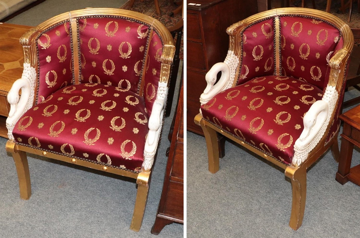 Lot 1296 - A pair of Empire style gilt decorated swan neck armchairs (2)