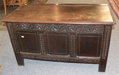 Lot 1297 - An 18th century carved oak coffer