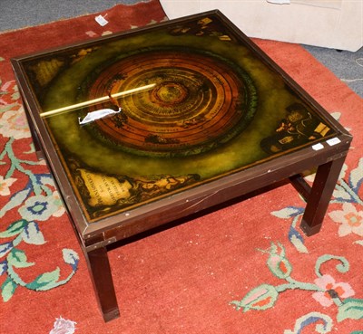 Lot 1310 - * A 1970's square coffee table, 'Planisphaerium' reverse printed glass top, 80cm wide