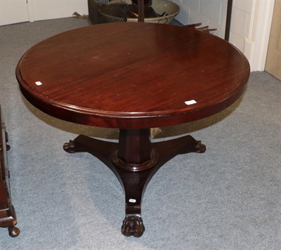 Lot 1311 - A 19th century circular topped mahogany pedestal table with tapering faceted standard on a...