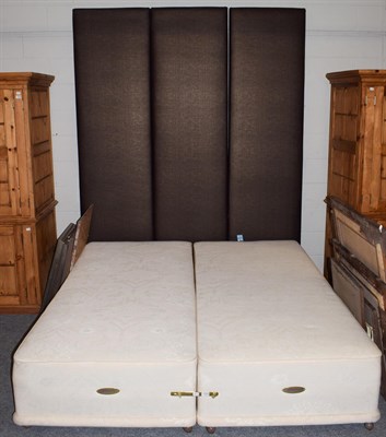 Lot 1319 - A Millbrook double bed, the veneered headboard with sectional fabric headboard