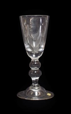 Lot 3 - A Baluster Glass Goblet, possibly Lauenstein, mid 18th century, the rounded funnel bowl on a double