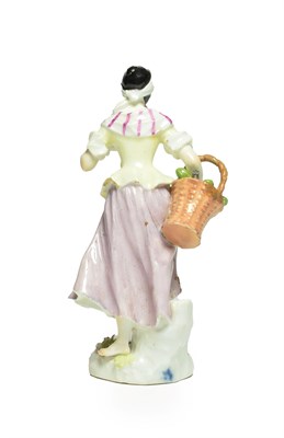 Lot 40 - A Meissen Porcelain Figure of a Street Vendor, circa 1750, modelled as a girl wearing a black...