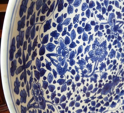 Lot 52 - A Chinese Porcelain Saucer Dish, Kangxi, painted in underglaze blue with lotus and other...