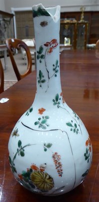Lot 59 - A Chinese Porcelain Vase, Kangxi, of fluted oval form with relief roundels, painted in...